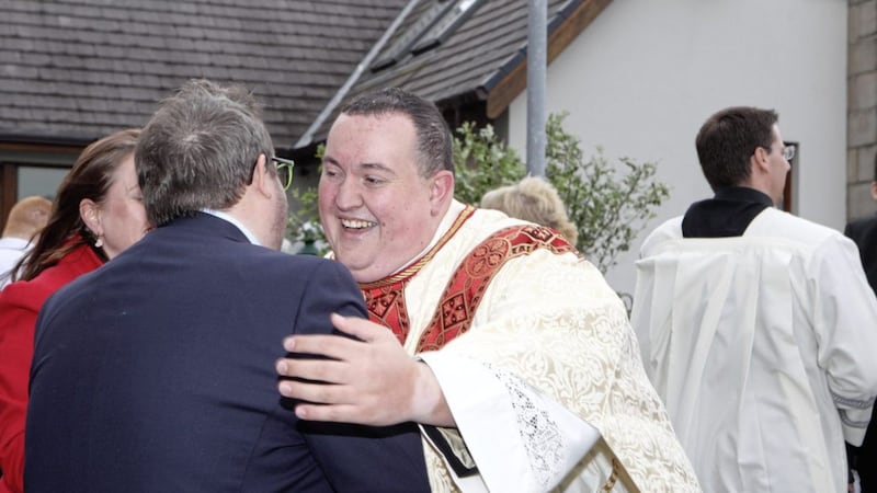 Tony McAleese is congratulated after being ordained yesterday. Picture by Matt Bohill, Pacemaker
