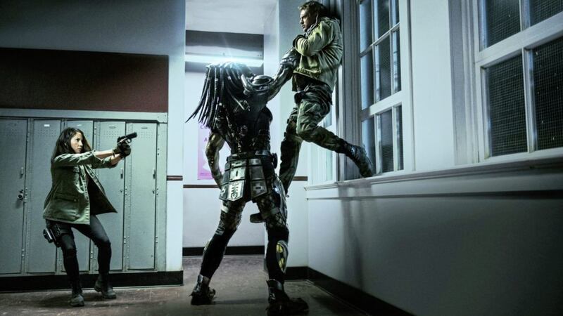 Olivia Munn and Boyd Holbrook get to grips with a Predator in The Predator 
