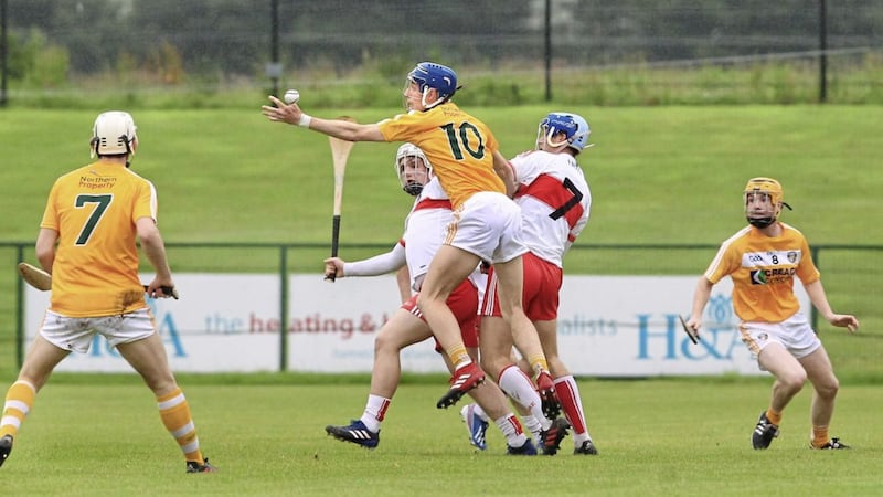 Derry&#39;s Cormac O&#39;Doherty and Shane McGuigan up against Antrim&#39;s James McNaughton during last week&#39;s Ulster U21 Hurling Championship semi-final at Owenbeg. Picture by Margaret McLaughlin 