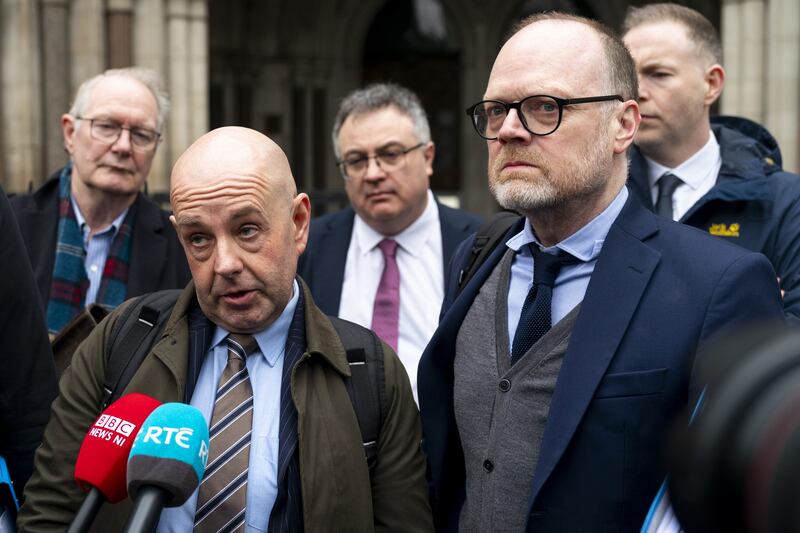 Journalists Barry McCaffrey (left) and Trevor Birney outside the Royal Courts of Justice in London