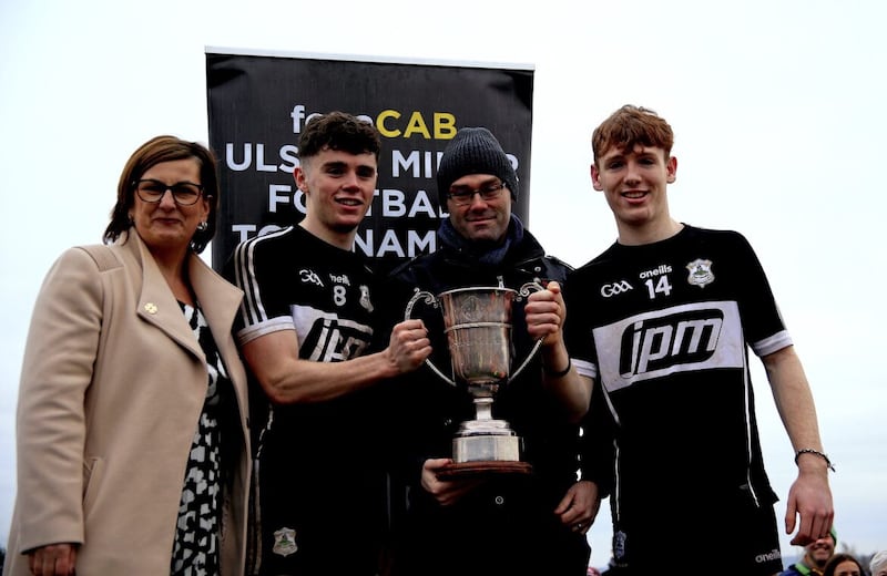 St Paul&#39;s chairperson Caroline McLoughlin, Eoin Huggins Sean Walsh [fonaCab] and Odhran Murphy of the Dungiven winning team. The 2023 tournament gets under way on December 9 Picture: Seamus Loughran 