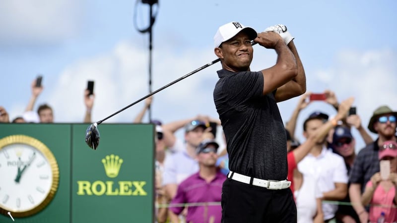 Tiger Woods tees off on the first hole at the Hero World Challenge golf tournament at Albany Golf Club in Nassau, Bahamas. The former world number one shot an opening round of 69 