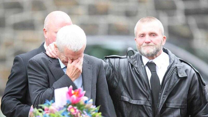 The father of Darren Rodgers is comforted during the funeral of his son at St Patrick's Church in Ballymena. Picture by Matt Bohill, Pacemaker Press