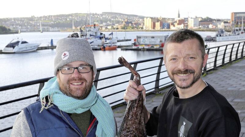 Derry fishmonger Brendan Moore with Canadian food adventurer Randy Lewis, pictured left, while filming an episode of Randy&#39;s LegenDerry Adventure for RTE.ie 