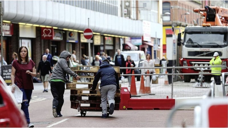 Youths wheeling pallets along Castle Street in Belfast city centre. Picture by Hugh Russell 
