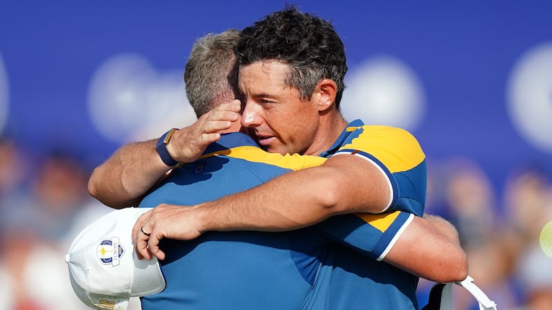 Rory McIlroy embraces captain Luke Donald following his singles match on day three of the 44th Ryder Cup in Rome (Mike Egerton/PA)