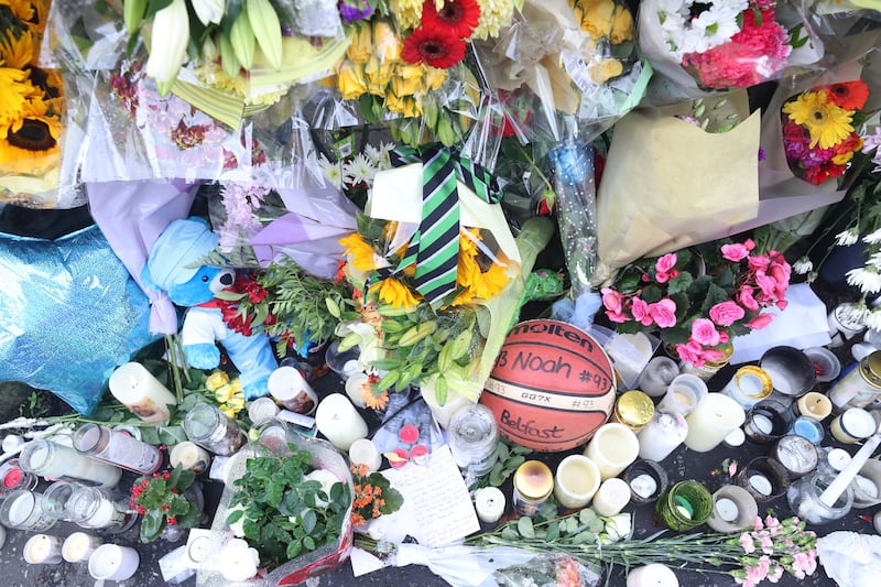 &nbsp;Floral tributes for Noah Donohoe outside his school, St Malachy's in north Belfast