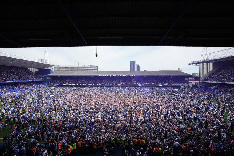 There’s some people on the pitch – Ipswich fans celebrate their side’s promotion