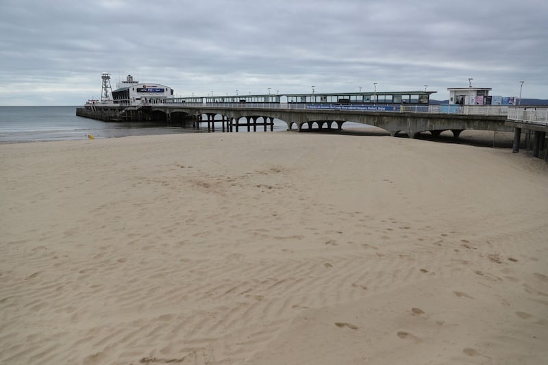 An empty beach and pier at Bournemouth in Dorset 