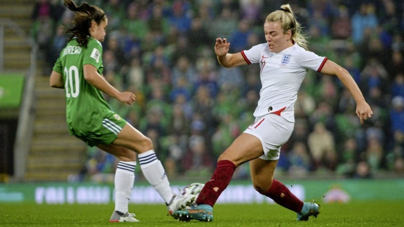 Northern Ireland's Joely Andrews challenges England's two-goal Lauren Hemp at Windsor Park.<br /> Photo Andrew McCarroll/ Pacemaker Press