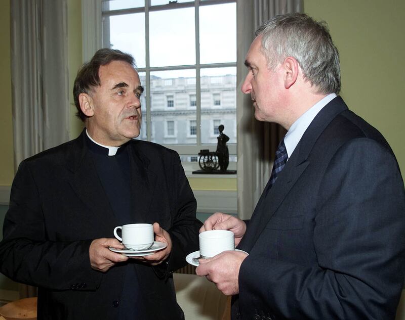 Irish Prime Minister Bertie Ahern talks with Father Aidan Troy, the Chairman of the Board of Governors of Holy Cross Primary School, Ardoyne, Northern Ireland, at Government buildings in Dublin
