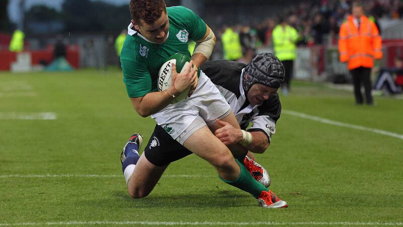Ireland's Paddy Jackson scores a try despite being tackled by Barbarians' Shane Jennings during the friendly match at Thomond Park, Limerick on Thursday May 28, 2015