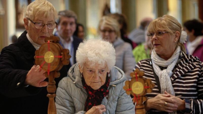 Parishioners  view the Padre Pio relics in St Peters Cathedral in west Belfast. Picture Mal McCann. 