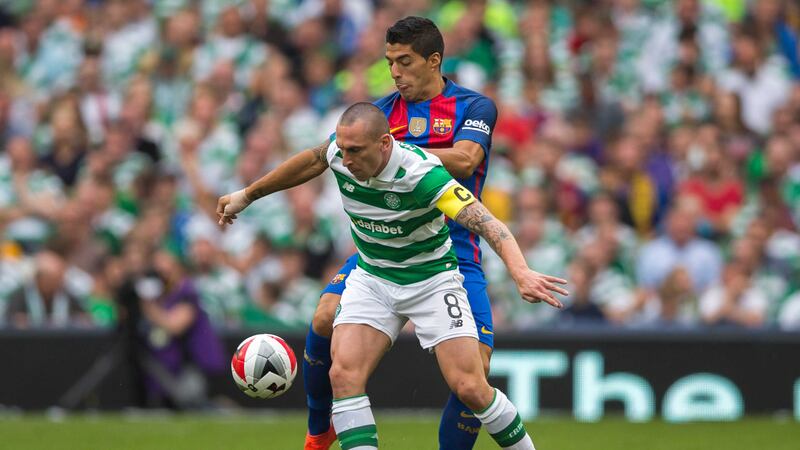 Celtic's Scott Brown and Barcelona's Luis Suarez battle for the ball during Saturday's International Champions Cup match at the Aviva Stadium, Dublin<br />Picture by PA&nbsp;