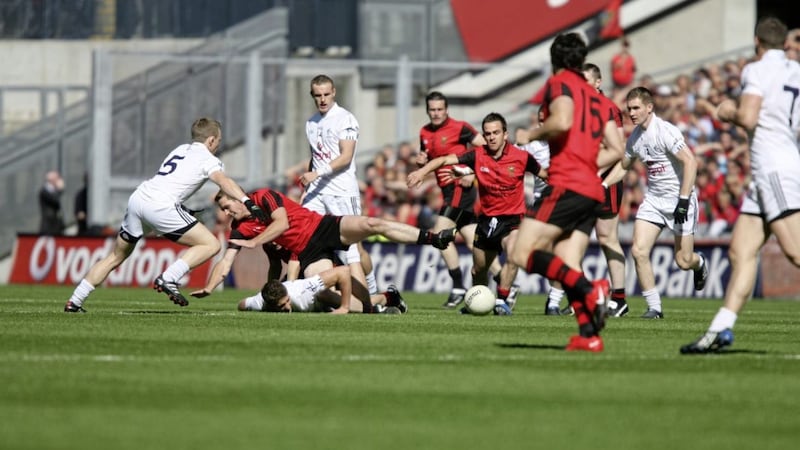 Mark Poland (centre) in the heat of battle against Kildare in 2010 