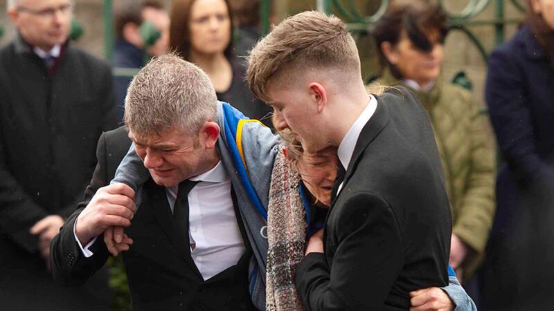 Maria Barnard, is supported by her partner and Morgan's father, James Bradley, at their son's&nbsp;funeral this morning in St Patrick's Church, Dungannon. Picture by Mark Marlow