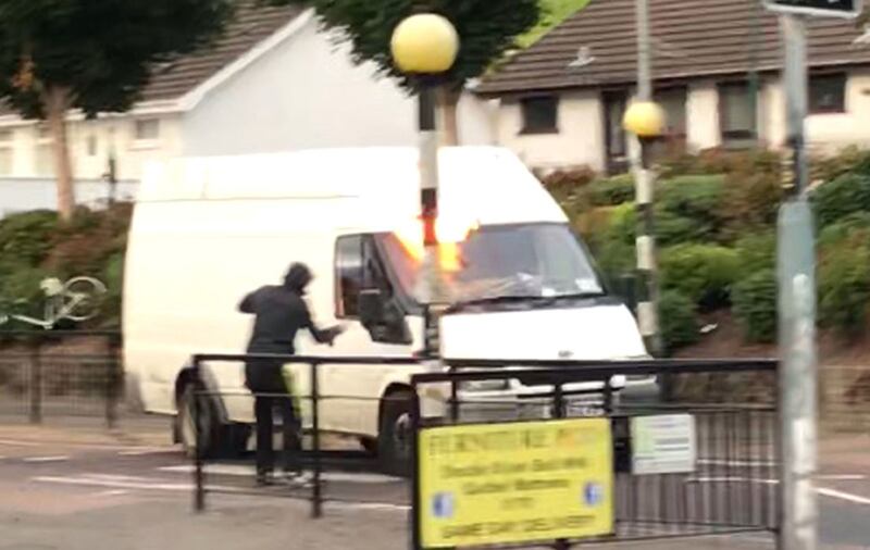 The video shows the youth throwing a petrol bomb at a van from point blank range&nbsp;