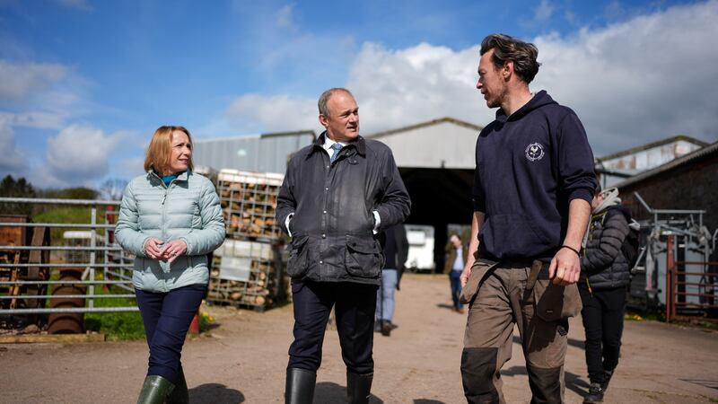 Liberal Democrat leader Sir Ed Davey (centre) and Helen Morgan, MP for North Shropshire, during a visit to Treflach Farm in Treflach, Shropshire