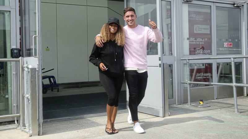 Love Island winners Greg O&#39;Shea, from Limerick and Amber Gill, from Newcastle, arrive at Stansted Airport in Essex following the final of the reality TV show. Picture: Yui Mok/PA Wire 