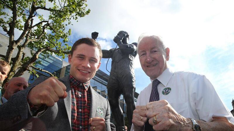 The brother of world flyweight champion Rinty Monaghan, Tommy, and current IBF super-bantamweight champion Carl Frampton at the statue unveiling. Picture by Hugh Russell
