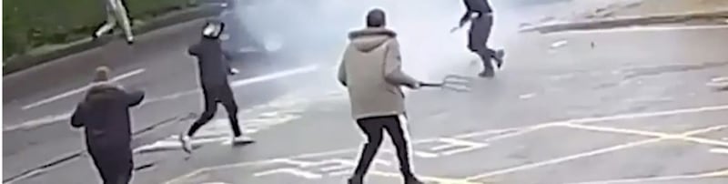A man was caught on CCTV footage running across the filling station forecourt carrying a pitch fork. Picture by Pacemaker. 