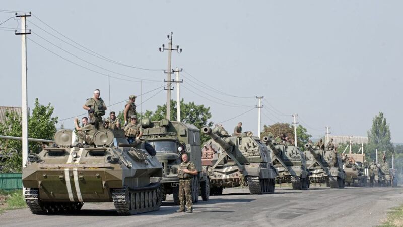 An army column of military vehicles prepares to roll to a frontline near Illovaisk, Donetsk region, eastern Ukraine earlier this year. Picture by Evgeniy Maloletka, Associated Press 