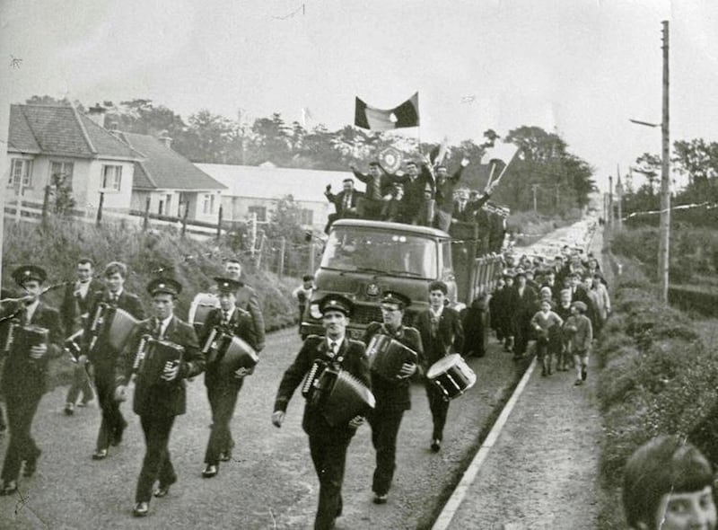 Pomeroy accordion band leads the triumphant Plunketts team through the village after winning the 1967 Tyrone Intermediate Football Championship 