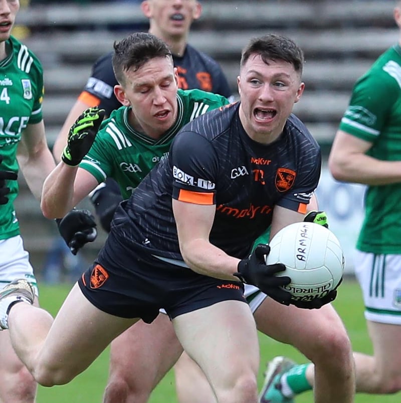 Fermanagh's Shane McGullion puts pressure on Armagh's Oisin Conaty during Sunday's Ulster Championship clash at Brewster Park. Pic Philip Walsh