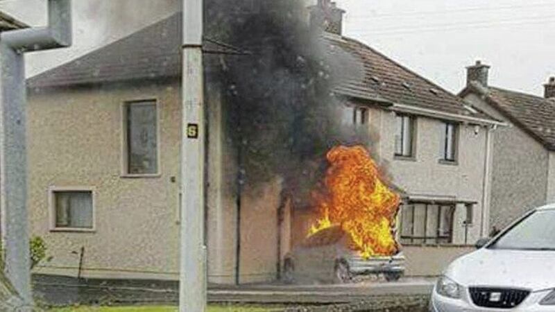A car was driven into a house in Larne yesterday in an attack being linked to a feud 