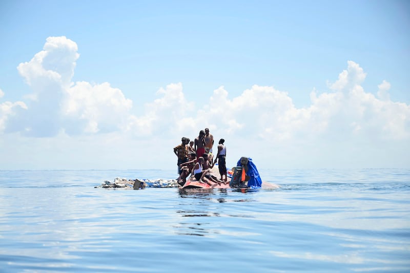 The wooden boat carrying dozens of Rohingya Muslims capsized off Indonesia’s northernmost coast on Wednesday, according to local fishermen (Reza Saifullah, AP)