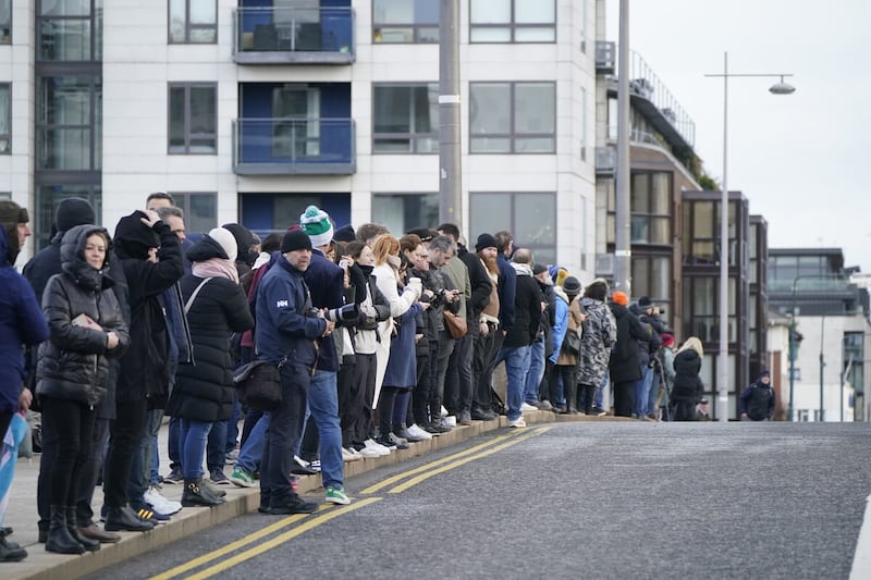 Crowds line the streets by Dublin Grand Canal dock as they wait for the funeral procession of Shane MacGowan to make its way through the streets of Dublin. Picture by Niall Carson/PA Wire
