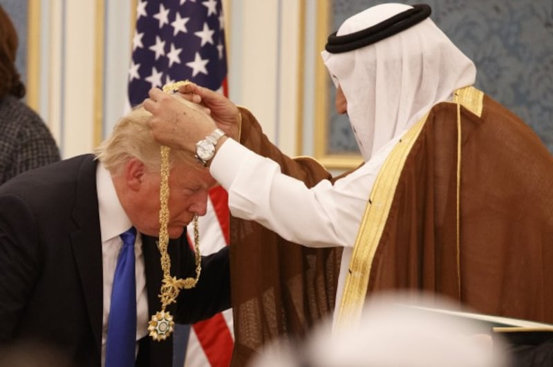 Saudi King Salman presents Trump with Trump with The Collar of Abdulaziz Al Saud Medal (Evan Vucci/AP)