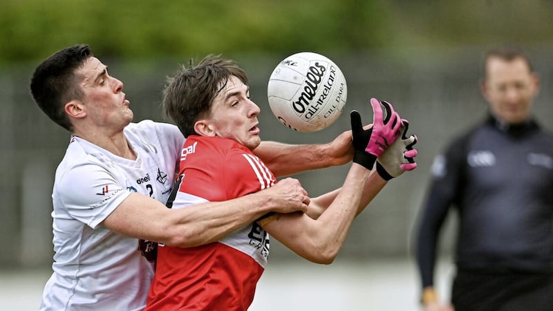 Paul Cassidy of Derry is tackled by Mick O&#39;Grady of Kildare at St Conleth&#39;s Park in Newbridge Picture by Piaras &Oacute; M&iacute;dheach/Sportsfile 