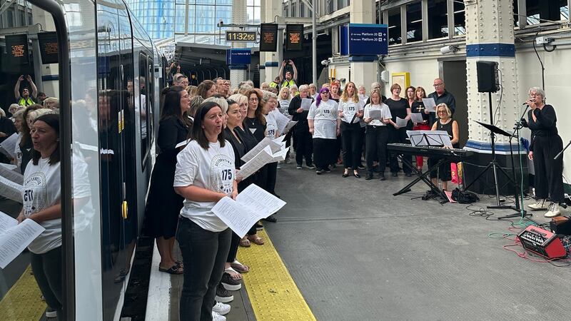 Network Rail and South Western Railway staff formed a choir to serenade passengers at London Waterloo to mark the station’s 175th anniversary (Network Rail/PA)