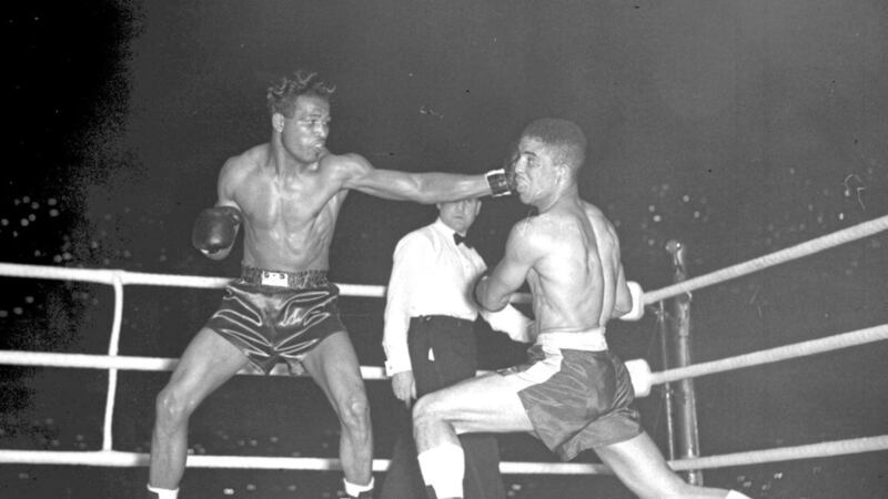 &#39;Sugar&#39; Ray Robinson lands a long left to the head of Randolph Turpin during their 1951 title bout at Earls Court in London. Turpin won that fight, but Robinson is regarded as one of the best to ever lace up gloves. Picture by PA 