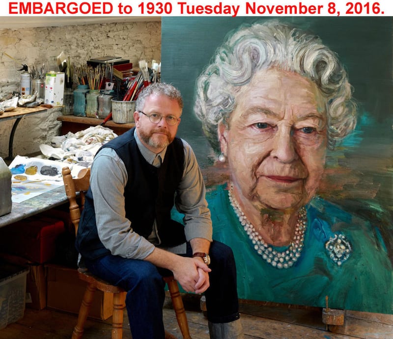 Colin Davidson, and the portrait of Queen Elizabeth, which he has painted on behalf of Co-operation Ireland in recognition of the monarch's work in promoting reconciliation in Northern Ireland. Picture by Colin Davidson/Press Association&nbsp;