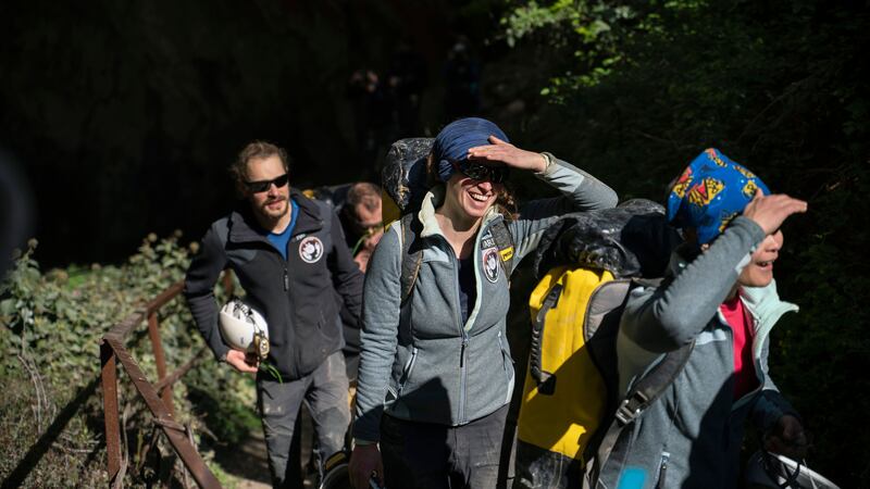 The participants emerged from the Lombrives cave in France wearing special glasses to protect their eyes.