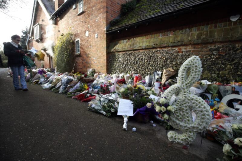 Floral tributes continue to be left outside the home of George Michael (Steve Parsons/PA)