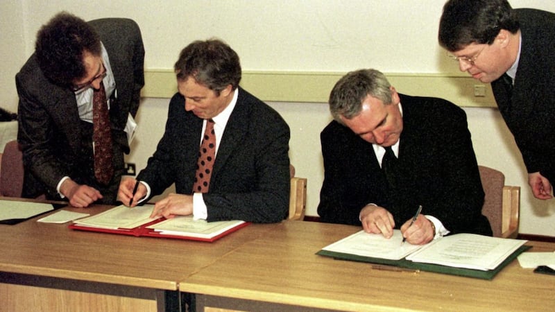 British Prime Minister Tony Blair and Taoiseach Bertie Ahern sign the Good Friday Agreement in 1998. Photo Dan Chung. 