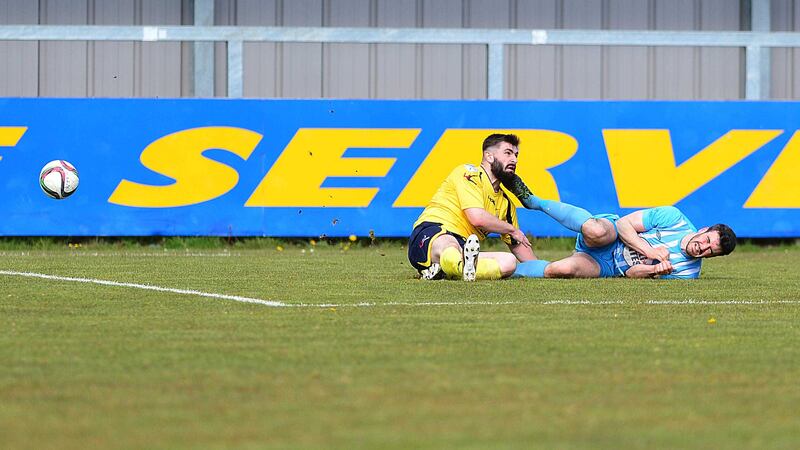 Warrenpoint's Jordan Dane and Dungannon's Cormac Burke pictured after the controversial tackle during Saturday's game<br/>Picture by Pacemaker&nbsp;