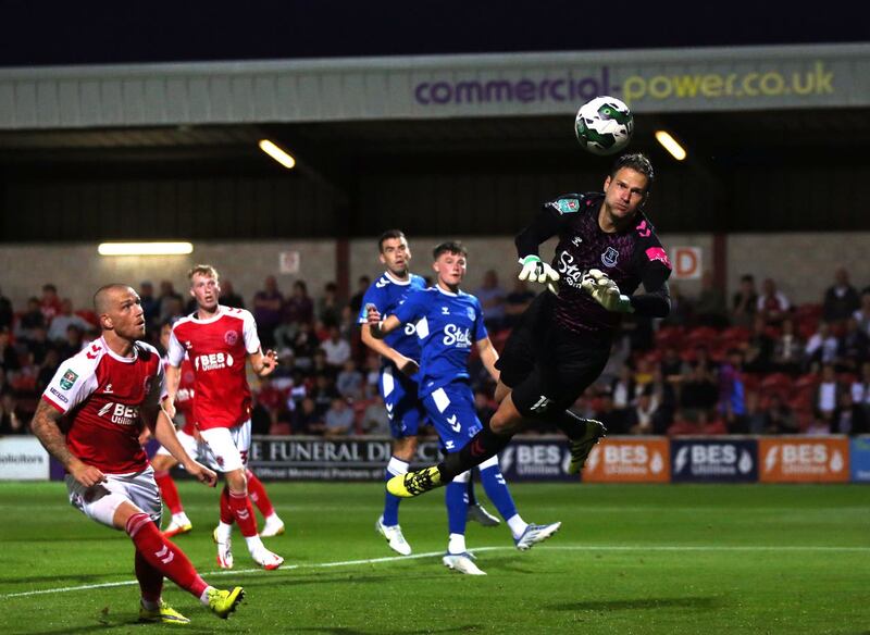 Asmir Begovic, right, saves a shot during a Carabao Cup tie against Fleetwood