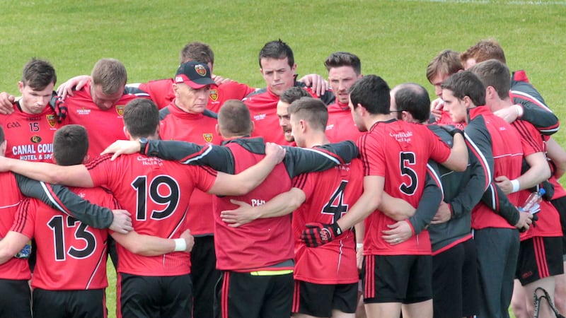 Down's Conor Laverty leads the team talk as then boss Jim McCorry looks on ahead of their ill-fated Ulster SFC game against Derry <br />Picture: Margaret McLaughlin
