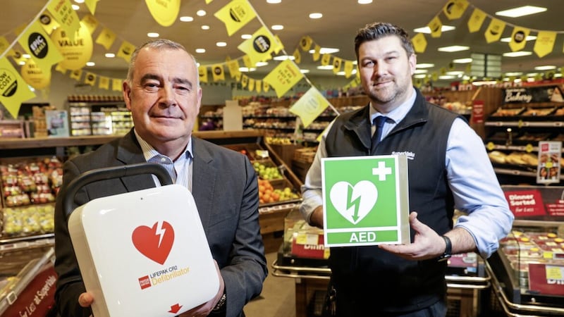 Trevor Magill, managing director of Musgrave NI, with Martin Reynolds, manager at SuperValu Lisburn. Picture: Brian Thompson 