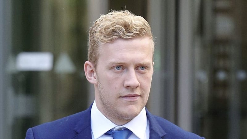 Ireland and Ulster Rugby player Stuart Olding on the way into court in Belfast. Picture by Hugh Russell. 