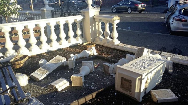 The bench, seen in the left of the photograph, where Connor McCarthy was sitting when a car crashed through his garden wall on the Crumlin Road in north Belfast on Tuesday night 
