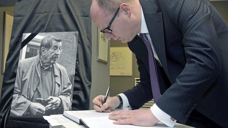 Pawel Adamowicz, the mayor of Gda?sk, signs a condolence book in memory of German writer Gunter Grass, in April 2015. File picture from Press Association 