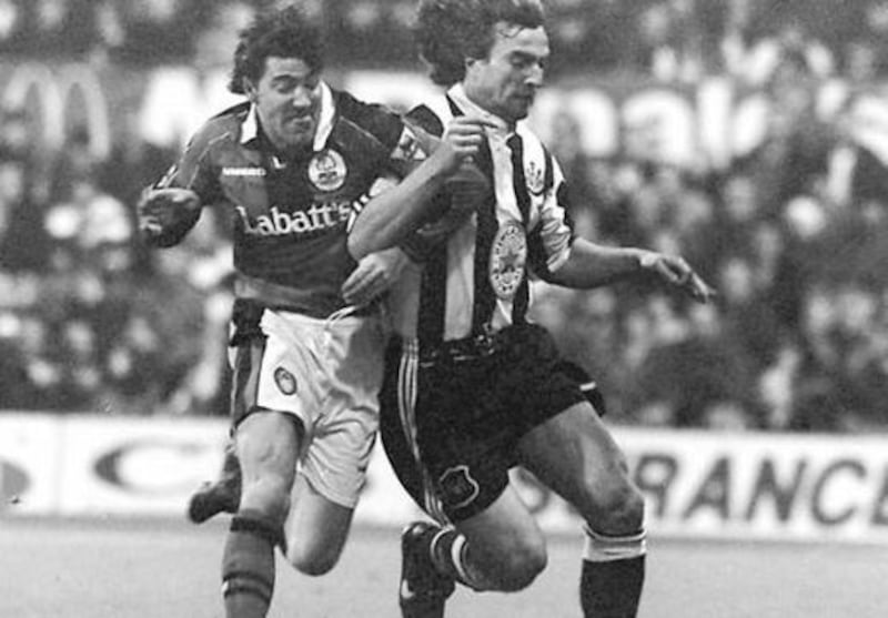 SHOULDER TO SHOULDER.....Newcastle&rsquo;s David Ginola and Notts Forest&rsquo;s Dean Saunders clash for the ball during last night&rsquo;s goalless draw at the City Ground.&nbsp;