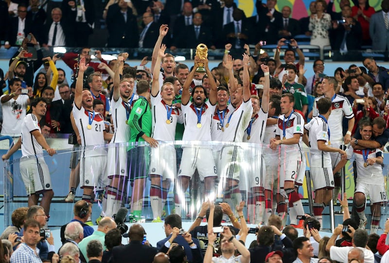 Germany's Sami Khedira lifts the World Cup trophy