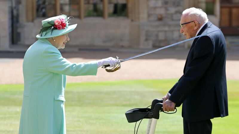 The Second World War veteran received the knighthood at Windsor Castle.