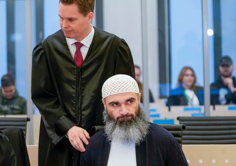 Zaniar Matapour with defence lawyer Marius Dietrichson in Oslo courthouse (Lise Aserud/AP)